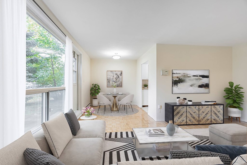 A living room with a grey couch and a coffee table.