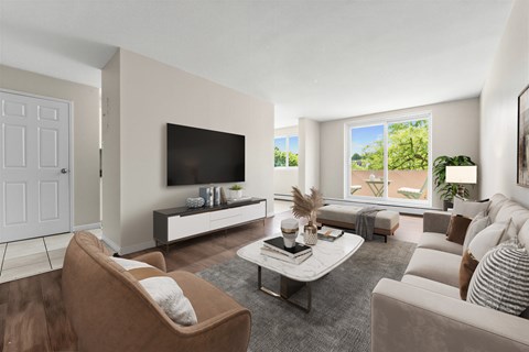 A living room with a brown chair and a white couch.