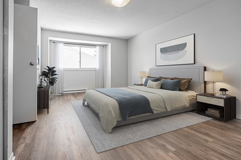 A bedroom with a bed, nightstand, and a plant.