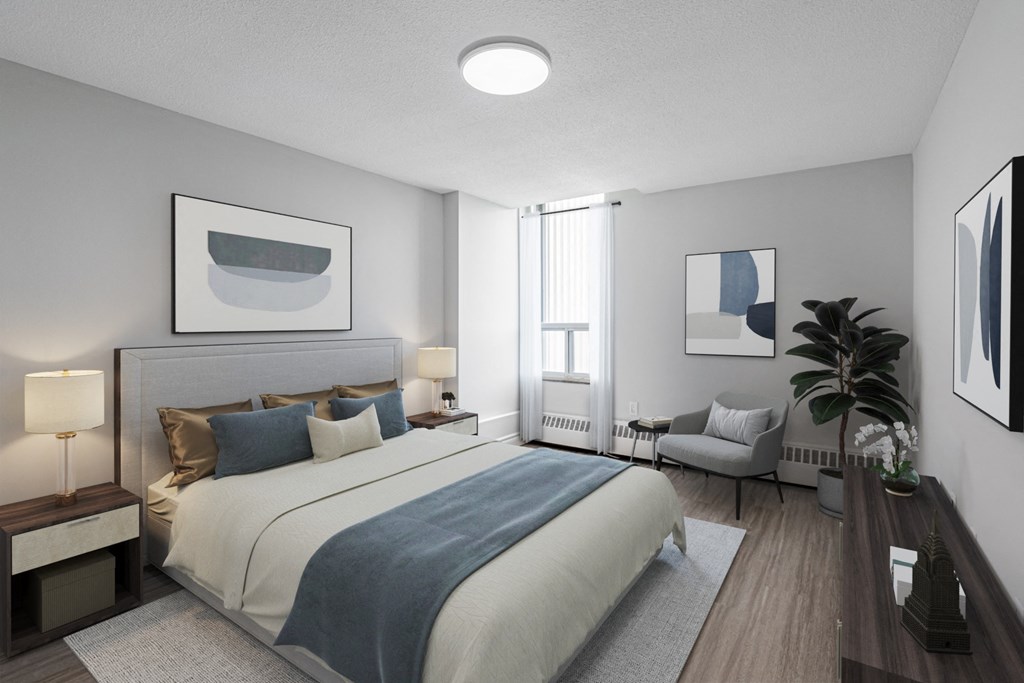 A bedroom with a large bed and a painting on the wall.