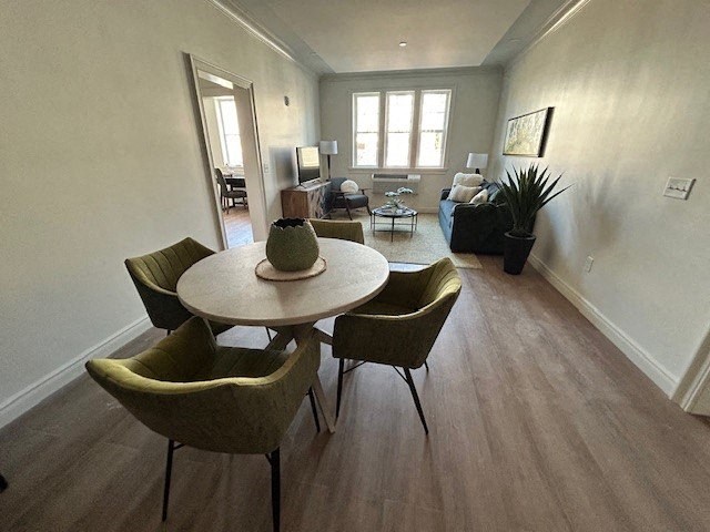 a dining room with a table and chairs