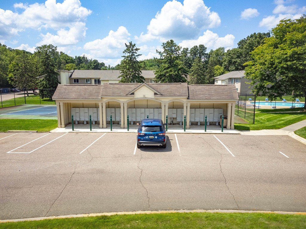 a parking lot with a car in front of a building