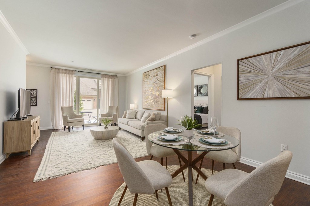 a living room with a table and chairs and a couch