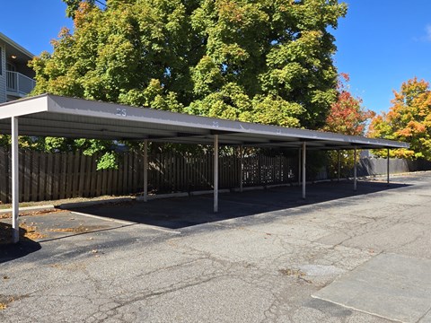 a covered parking lot with a canopy