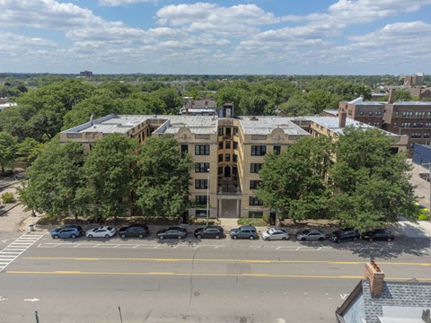 A large building with a parking lot in front of it.