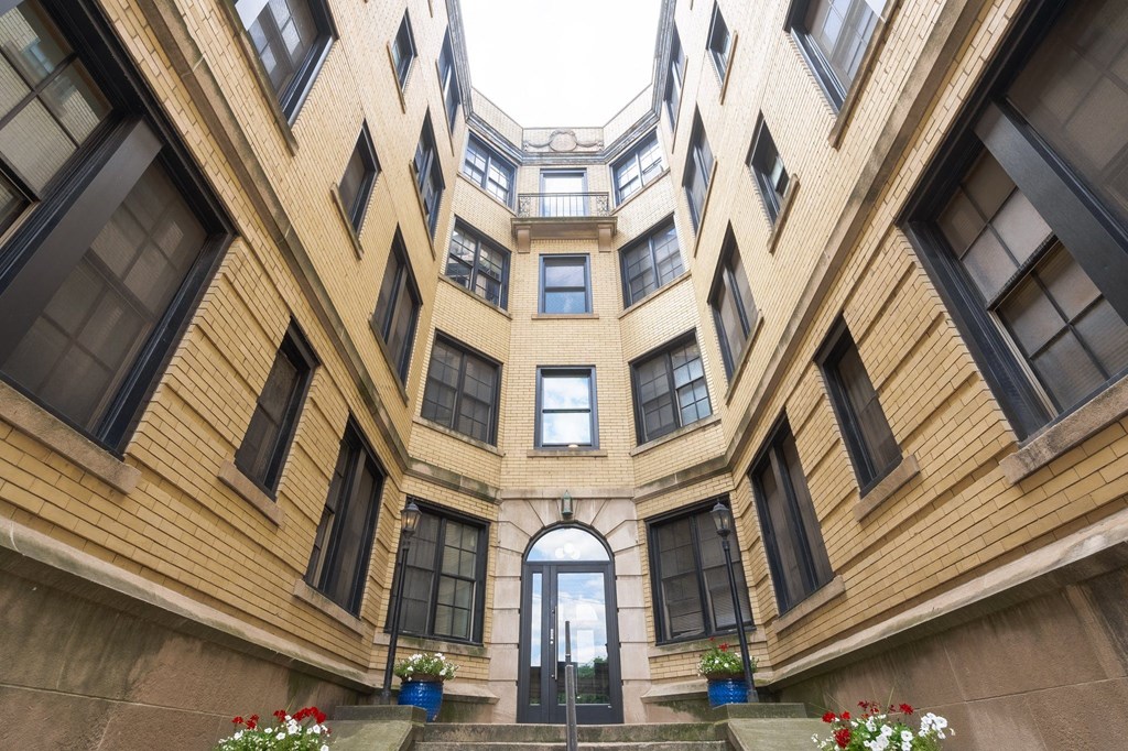 a large building with an archway in the middle