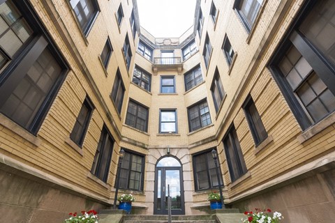 a large building with an archway in the middle