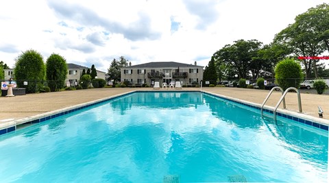A large swimming pool in the middle of a residential area.