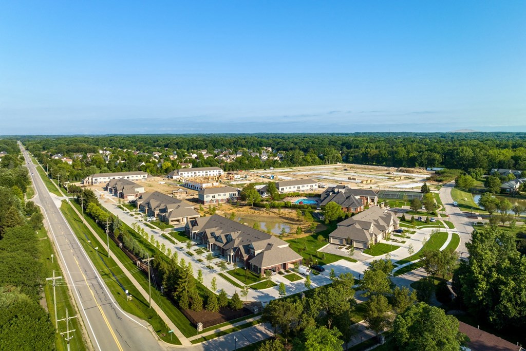 an aerial view of a neighborhood of houses and a parking lot