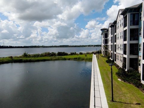 A view of a lake with a building on the right side.