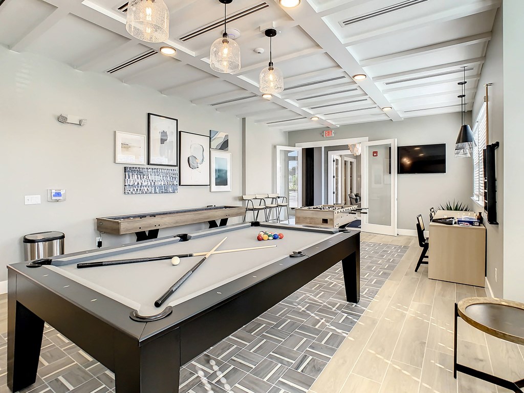 play a game of pool in our game room at our apartments