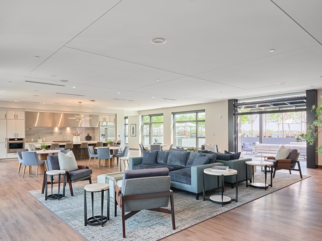 A modern living room with grey and white furniture.
