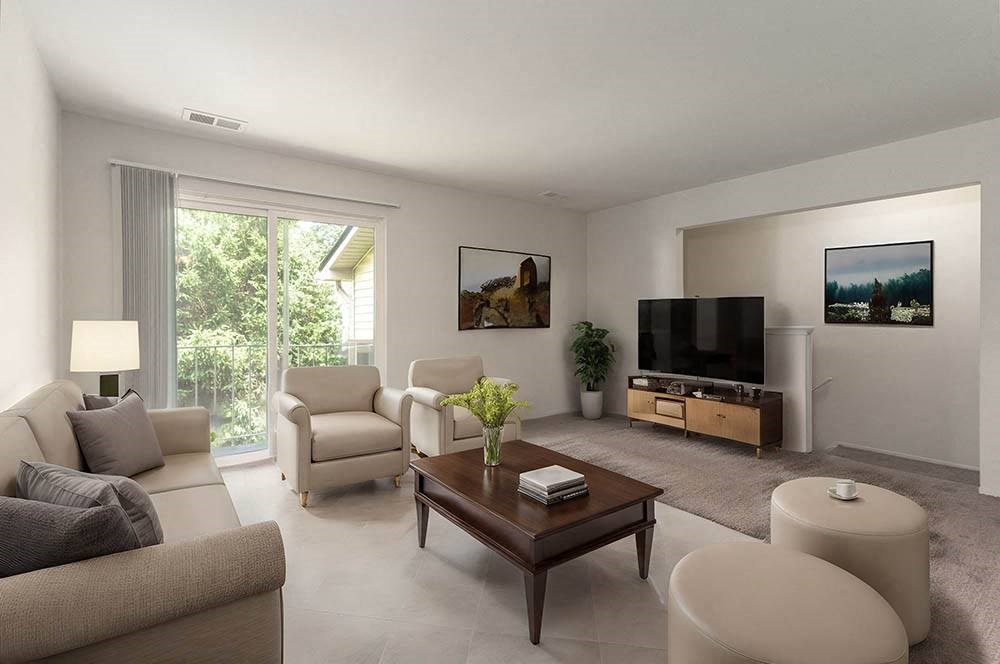 a living room with a couch a table and a television