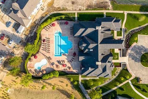 an aerial view of an urban cityscape with a pool of water
