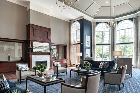 A living room with a fireplace and a chandelier.