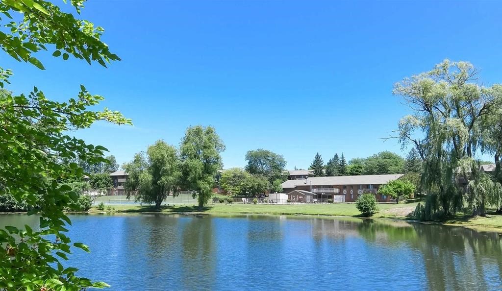 a view of a lake with a house in the background