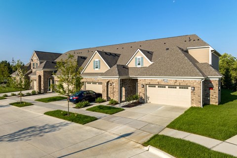 a house with a roof on a street