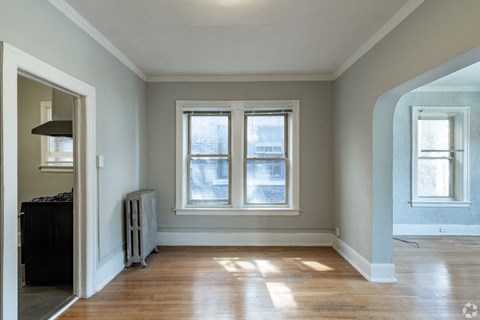 A room with a window and a radiator.