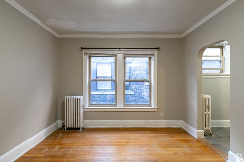 A room with a window and a radiator.