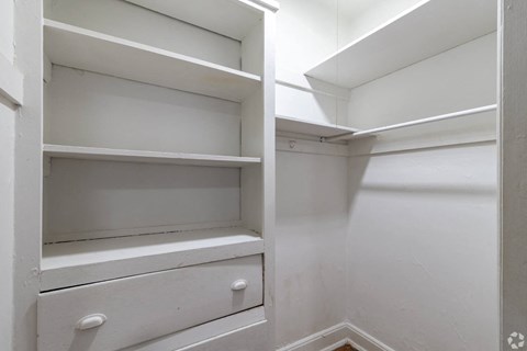 the closet in the master bathroom has plenty of shelves