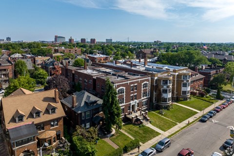 A view of a town with buildings and cars.