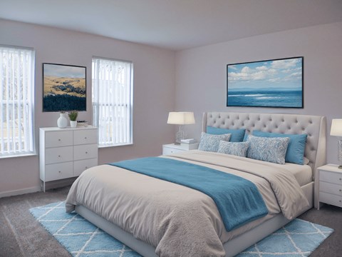 A bedroom with a large bed and a painting on the wall.