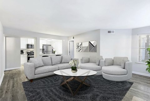 A modern living room with a grey sofa set and a coffee table.