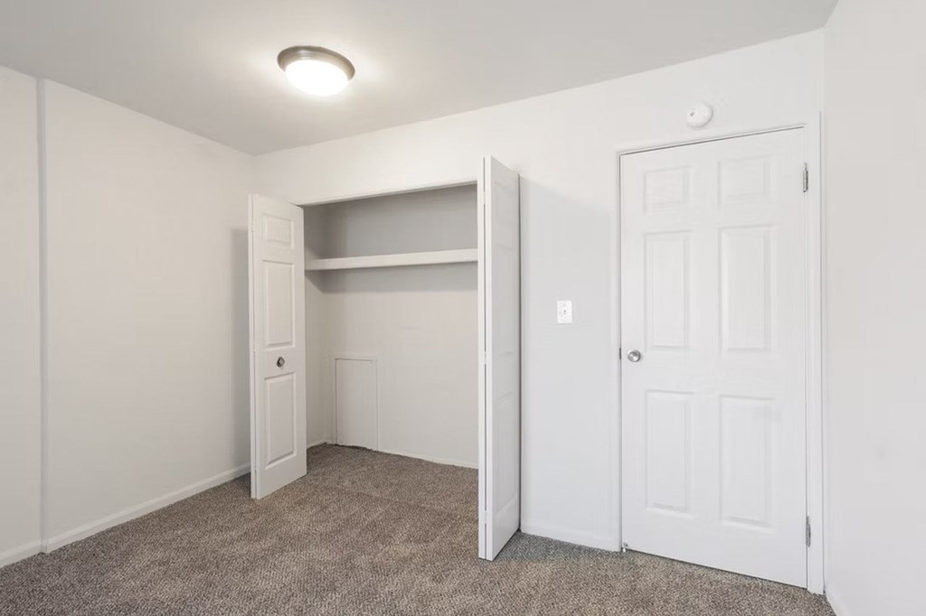 A white door is on the right side of the image.