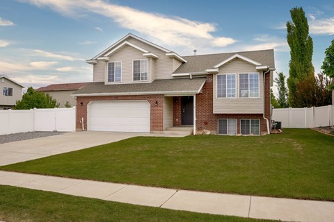 A house with a garage and a driveway.