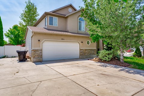 A house with a garage and a driveway.