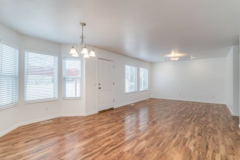 A room with wooden floors and white walls.