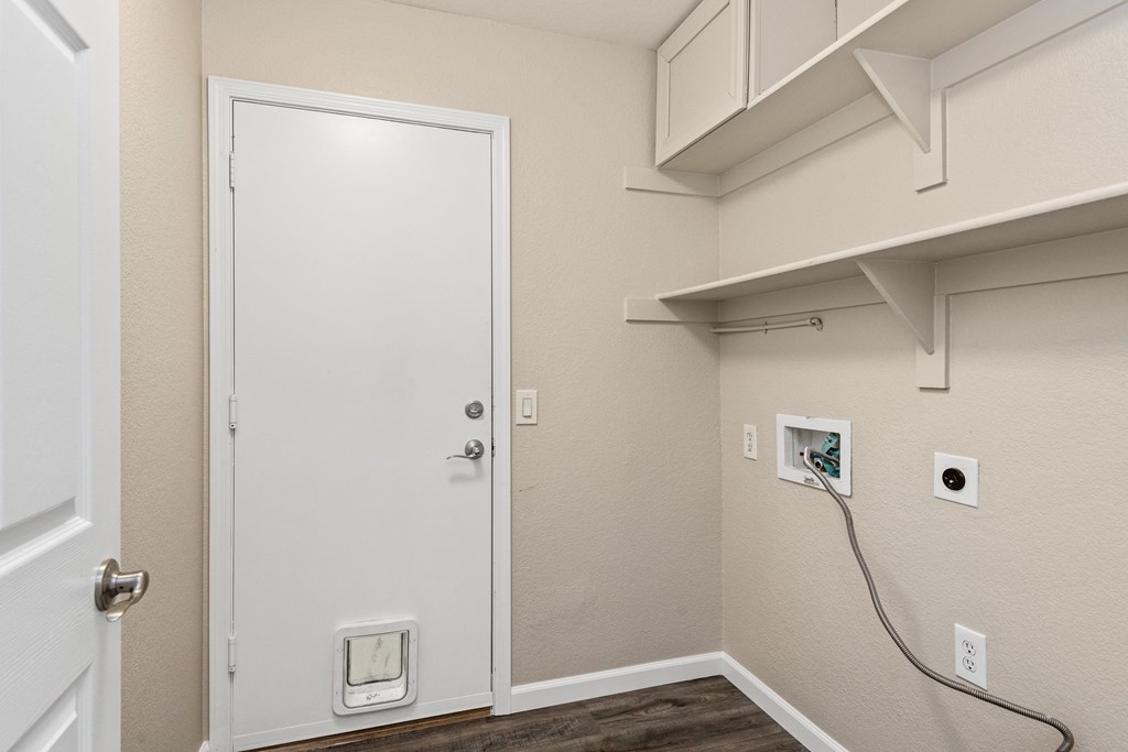 a door to a room with a white doorframe and a white wall with a