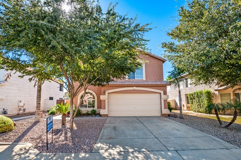 a house with a driveway and a garage door