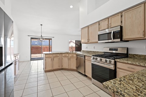 A kitchen with a stove top oven and microwave.