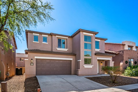 A house with a brown garage door and a brown driveway.