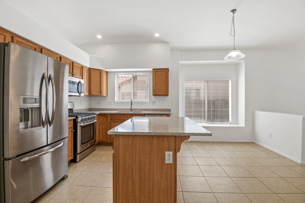 a kitchen with stainless steel appliances and a counter top