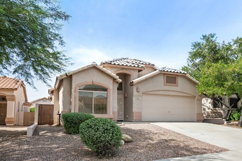 a house with a driveway and a garage door