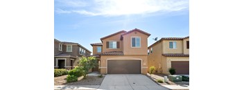 A house with a brown garage door in front of it.