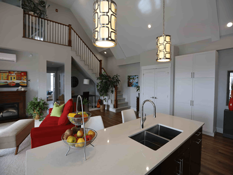 a view of the kitchen and living room of a house