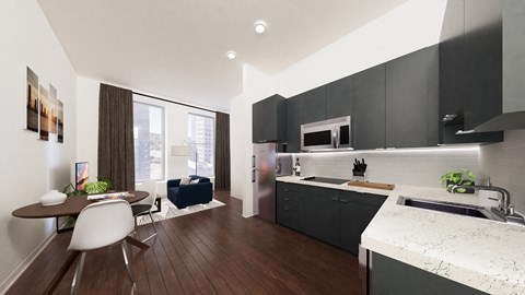 a kitchen with black cabinets and a table and chairs