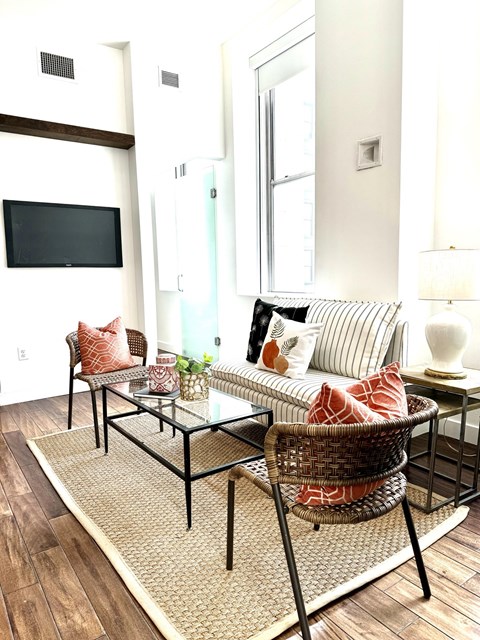 a living room with a couch and a table and a television