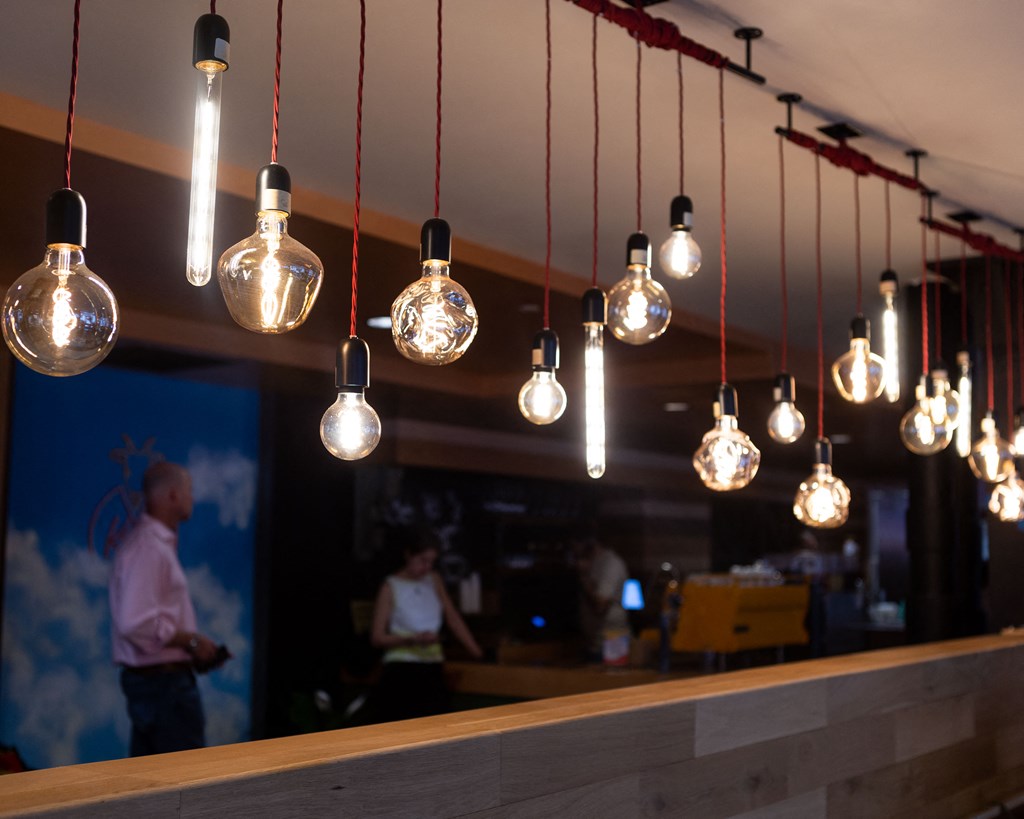 light bulbs hanging from a ceiling above a bar