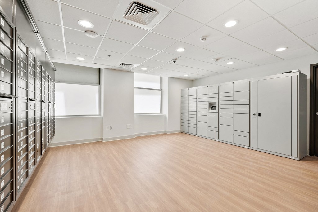 a large room with many filing cabinets and a wood floor