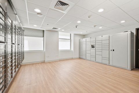 a large room with many filing cabinets and a wood floor