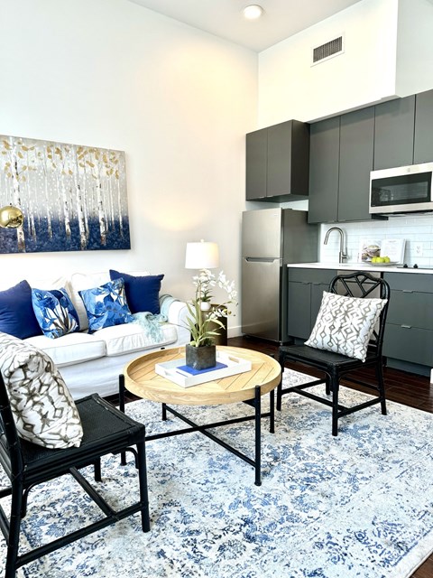 a living room with a white couch and a coffee table