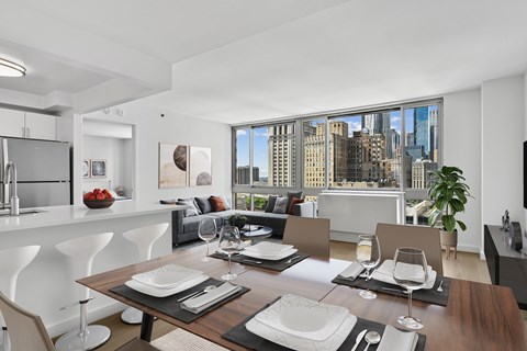 A modern dining room with a view of the city.