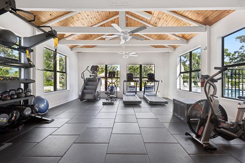 A spacious home gym with a variety of exercise equipment.