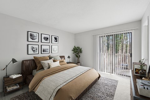 A bedroom with a large bed and a window with blinds.