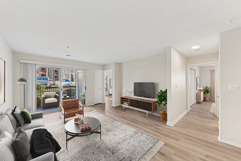 A living room with a grey sofa and a coffee table.