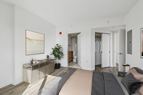 A living room with a grey sofa and a wooden cabinet.